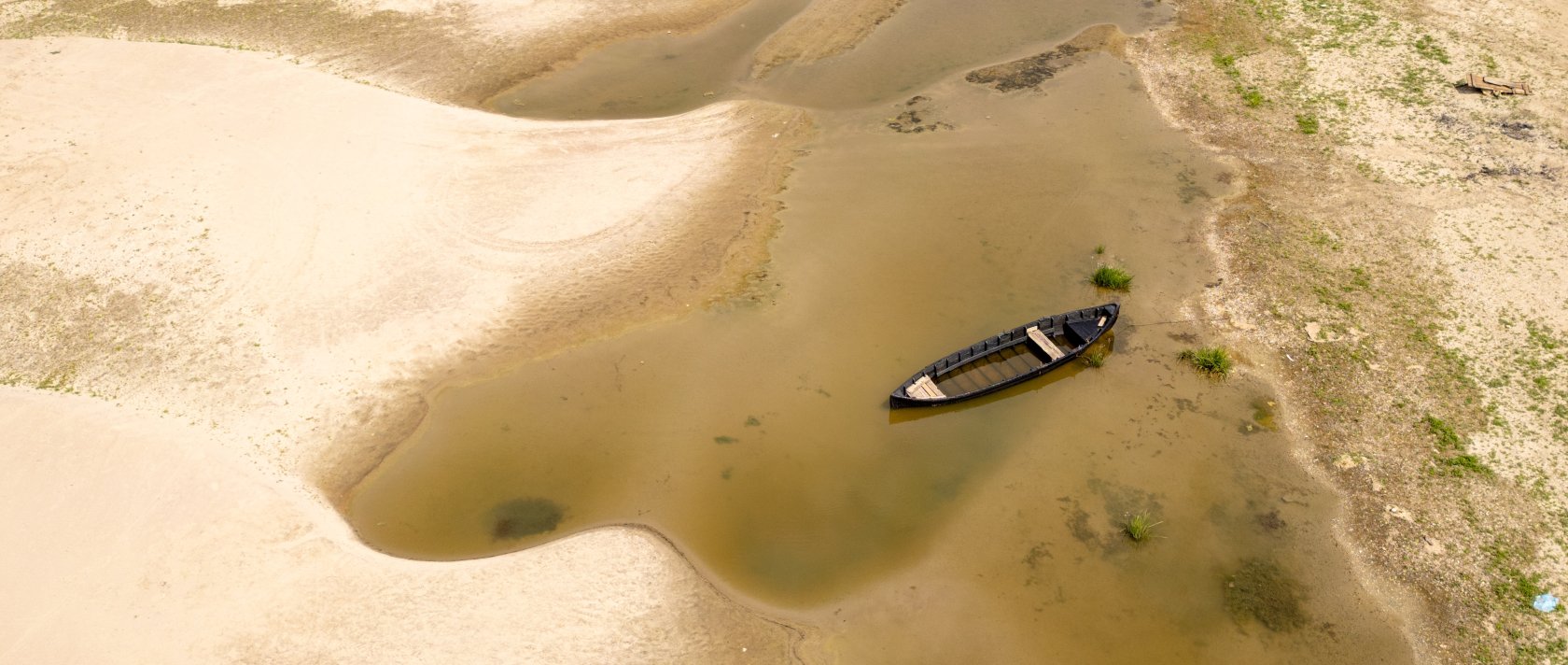 Usually submerged areas of the Danube River are exposed amid exceptionally low water levels, Rasova, Romania, Aug. 3 2026. (AP Photo)