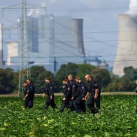 German police officers search a field near a power plant after a second sabotage attempt on Germany's electricity grid, with local police saying they are investigating an attack on a substation in Bergheim, Germany, Sept. 2, 2026. (Reuters Photo)