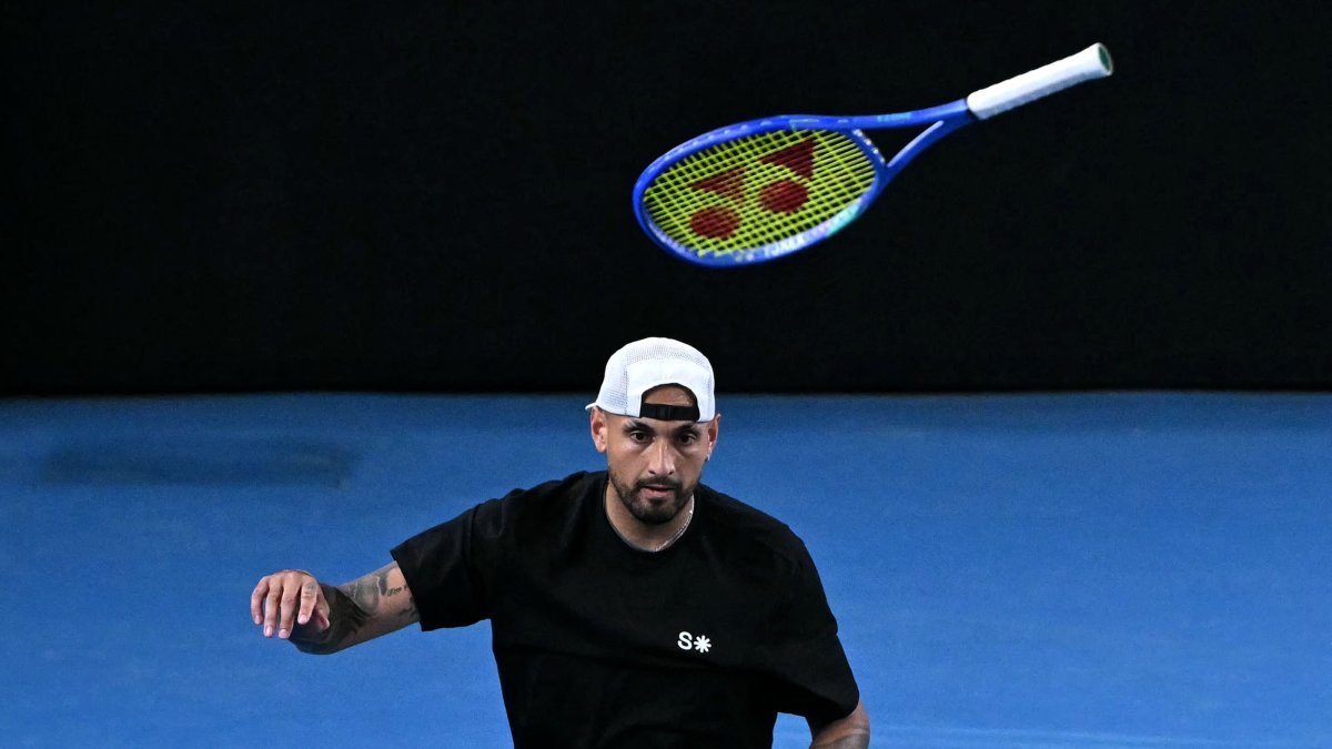 Australia's Nick Kyrgios throws his racket during his men's doubles match against compatriot Jason Kubler and Marc Polmans on day five of the Australian Open tennis tournament, Melbourne, Australia, Jan. 22, 2026. (AFP Photo)