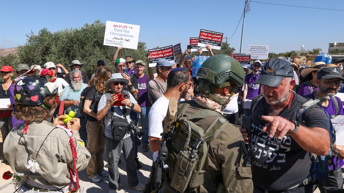 Israeli forces block peace activists carrying food and water from reaching Palestinian families whose homes have been cut off from supplies by illegal Israeli settlers in the village of Qusra, south of the city of Nablus in the Israeli-occupied West Bank, Sept. 4, 2026. (AFP Photo)