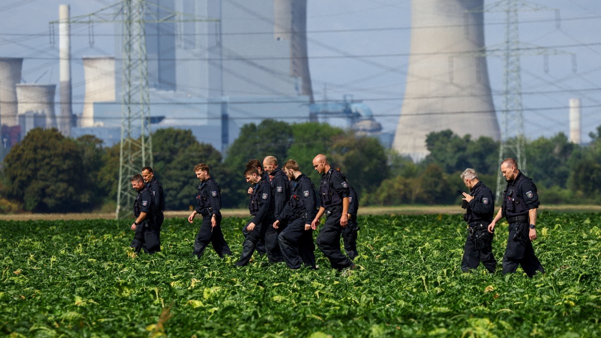 German police officers search a field near a power plant after a second sabotage attempt on Germany's electricity grid, with local police saying they are investigating an attack on a substation in Bergheim, Germany, Sept. 2, 2026. (Reuters Photo)