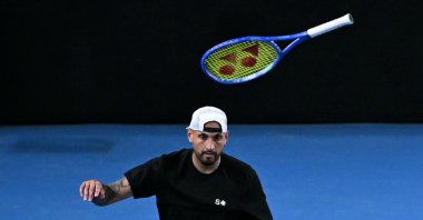 Australia's Nick Kyrgios throws his racket during his men's doubles match against compatriot Jason Kubler and Marc Polmans on day five of the Australian Open tennis tournament, Melbourne, Australia, Jan. 22, 2026. (AFP Photo)