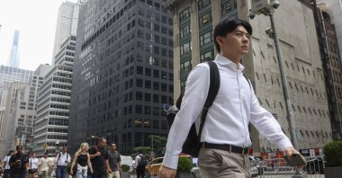 People walk on the sidewalk in Midtown Manhattan in New York, U.S., Aug. 6, 2026. (EPA Photo)