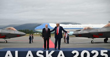 U.S. President Donald Trump and Russian President Vladimir Putin pose on a podium on the tarmac after they arrived at Joint Base Elmendorf-Richardson in Anchorage, Alaska, Aug. 15, 2025. (AFP File Photo)