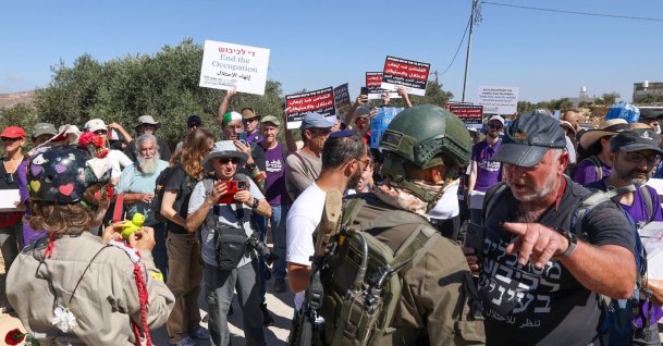 Israeli forces block peace activists carrying food and water from reaching Palestinian families whose homes have been cut off from supplies by illegal Israeli settlers in the village of Qusra, south of the city of Nablus in the Israeli-occupied West Bank, Sept. 4, 2026. (AFP Photo)