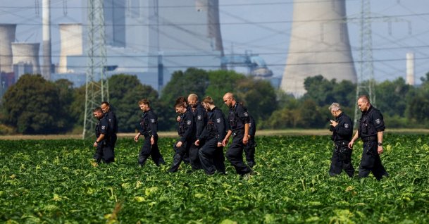 German police officers search a field near a power plant after a second sabotage attempt on Germany's electricity grid, with local police saying they are investigating an attack on a substation in Bergheim, Germany, Sept. 2, 2026. (Reuters Photo)