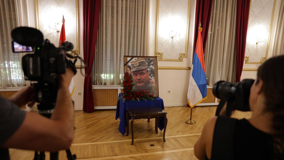 Photographers take photos of a portrait of former Bosnian Serb general Ratko Mladic during a commemoration held in his memory in Belgrade, Serbia, Sept. 5, 2026. (EPA Photo)