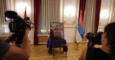 Photographers take photos of a portrait of former Bosnian Serb general Ratko Mladic during a commemoration held in his memory in Belgrade, Serbia, Sept. 5, 2026. (EPA Photo)