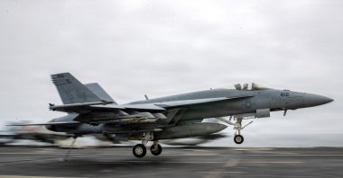 In this US Navy handout photo, an F/A-18 Super Hornet, attached to Strike Fighter Squadron (VFA) 195, lands on the flight deck of the Nimitz-class aircraft carrier USS George Washington (CVN 73), Aug. 27, 2026. (AFP Photo)