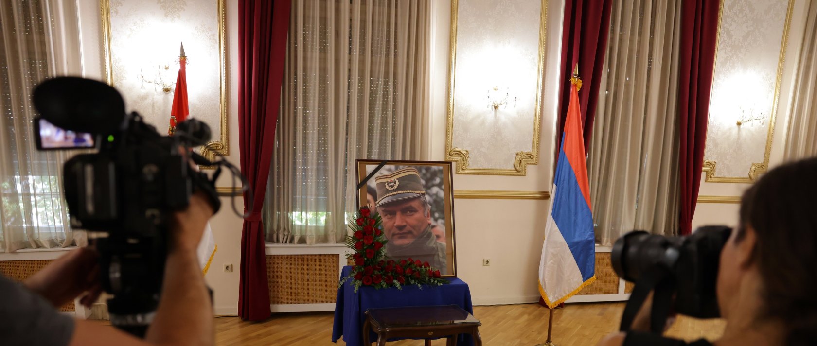 Photographers take photos of a portrait of former Bosnian Serb general Ratko Mladic during a commemoration held in his memory in Belgrade, Serbia, Sept. 5, 2026. (EPA Photo)
