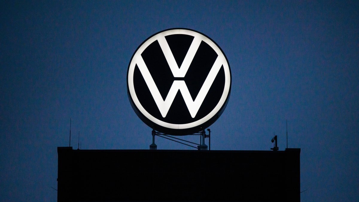 The logo of the automotive company Volkswagen is illuminated at a building of the VW factory, Wolfsburg, Germany, Oct. 29, 2024. (EPA Photo)