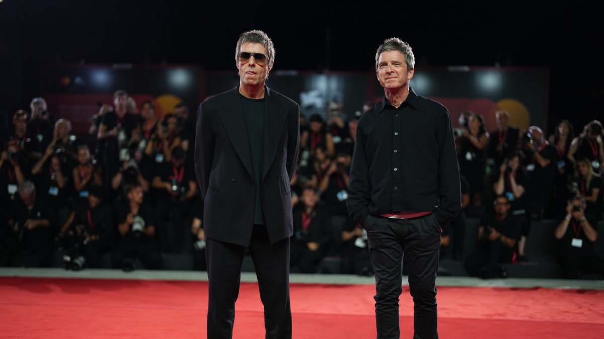 Liam (L) and Noel Gallagher pose for photographers on the red carpet for the film "Oasis: Don't Look Back In Anger" at the 83rd edition of the Venice Film Festival, Venice, Italy, Sept. 5, 2026. (AP Photo)