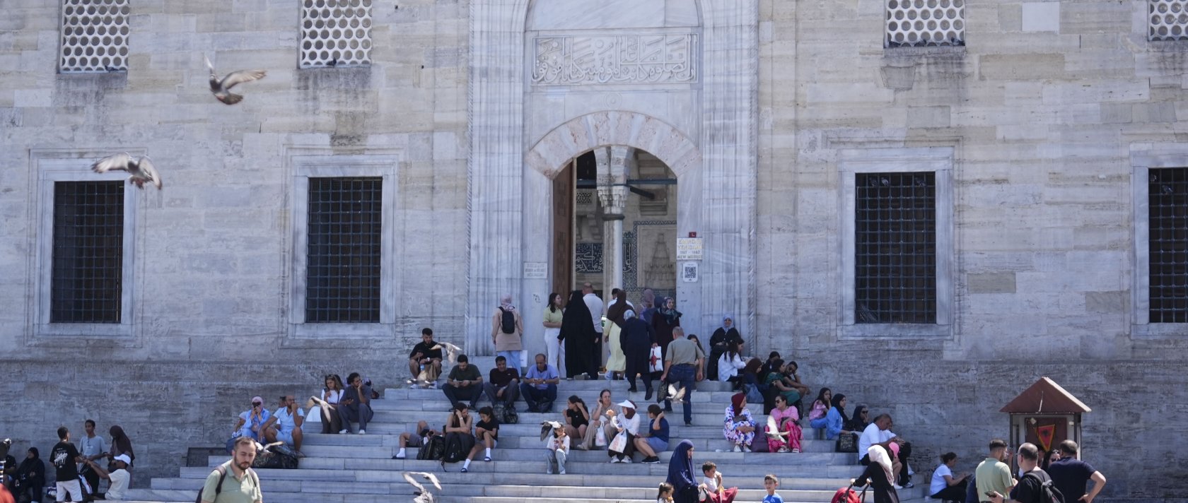 People are photographed in front of a mosque in Istanbul, Türkiye, Aug. 21, 2026. (AA Photo)