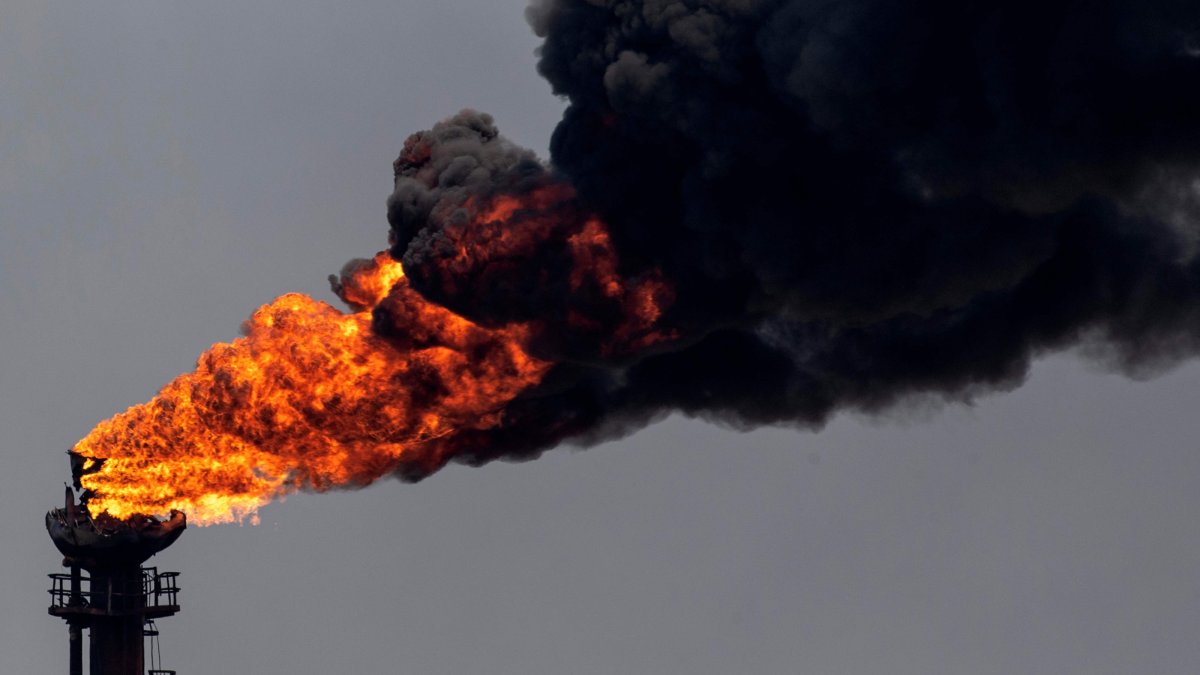 A view of a chimney at an oil refining plant of state-owned Petroleos de Venezuela (PDVSA), Puerto La Cruz, Anzoategui state, Venezuela, Nov. 4, 2021. (AFP Photo)