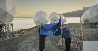 Workers adjust an EU flag during a visit of the President of the European Commission Ursula von der Leyen to Nuuk, Greenland, Sept. 7, 2026. (EPA Photo)