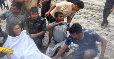 Nepali survivor Chandika Shrestha being rescued by Armed Police Force personnel from the fourth floor of a four-storey house in Betrawati, Bidur Municipality-10, Nuwakot District, Nepal, Sept. 5, 2026. (EPA Photo)
