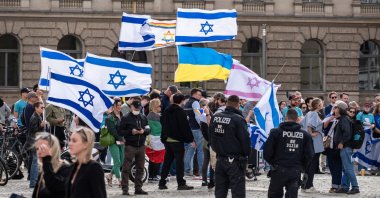 People carry Israeli flags during a "stop-the-left" demonstration, Berlin, Germany, Sept. 5, 2026. (Getty Images Photo)
