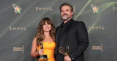 Linda Cardellini and David Harbour pose with the awards for outstanding supporting actress in a limited or anthology series or movie and outstanding supporting actor in a limited or anthology series or movie for "DTF St. Louis" during night two of the Creative Arts Emmy Awards, Los Angeles, U.S., Sept. 6, 2026. (AP Photo)
