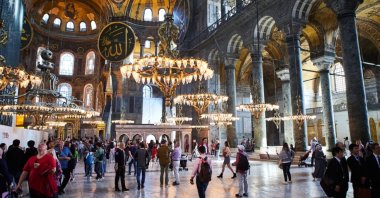 An interior view of the Hagia Sophia Grand Mosque as visitors tour, Istanbul, Türkiye, Oct. 10, 2019. (Shutterstock Photo)