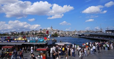 People walk in the historic district of Eminönü in Istanbul, Türkiye, Aug. 16, 2026. (AA Photo)