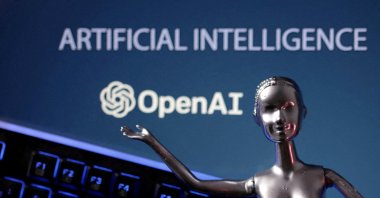 OpenAI logo and AI Artificial Intelligence words are seen in this illustration taken May 4, 2023. (Reuters Photo)
