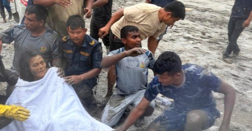 Nepali survivor Chandika Shrestha being rescued by Armed Police Force personnel from the fourth floor of a four-storey house in Betrawati, Bidur Municipality-10, Nuwakot District, Nepal, Sept. 5, 2026. (EPA Photo)