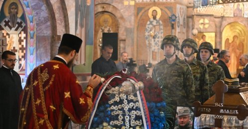 An Orthodox priest blesses the coffin of the late Bosnian Serb military leader Ratko Mladic during a public memorial on the day of his funeral ceremony at St Lukas church, Belgrade, Serbia, Sept. 7, 2026. (AFP Photo)