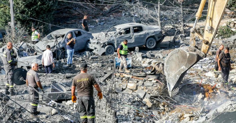 An excavator digs as rescuers search for survivors amidst the rubble following an overnight Israeli airstrike on the village of Kfar Roummane, Lebanon, Sept. 7, 2026. (AFP Photo)