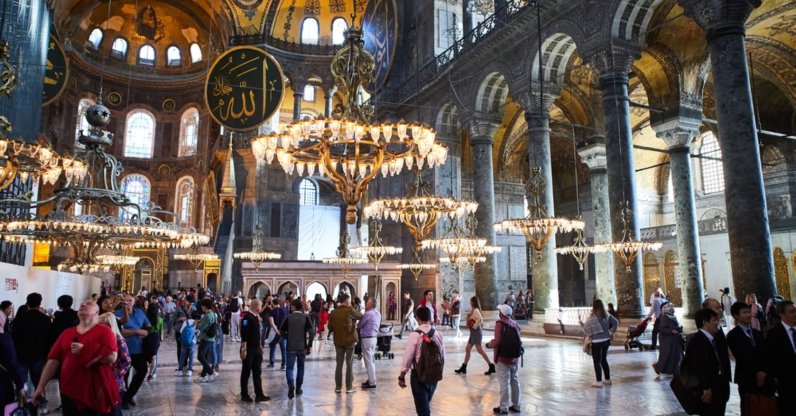An interior view of the Hagia Sophia Grand Mosque as visitors tour, Istanbul, Türkiye, Oct. 10, 2019. (Shutterstock Photo)