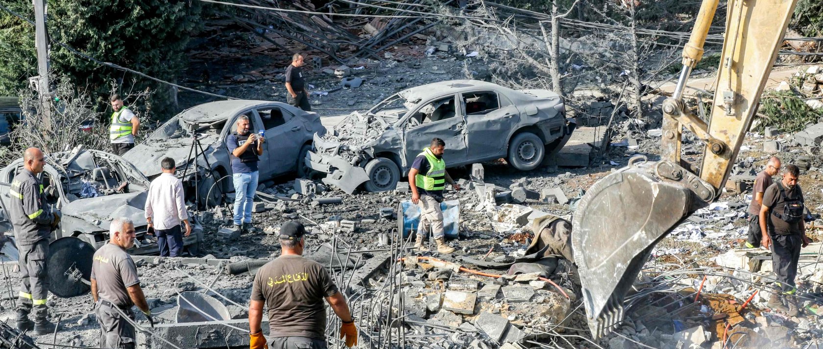An excavator digs as rescuers search for survivors amidst the rubble following an overnight Israeli airstrike on the village of Kfar Roummane, Lebanon, Sept. 7, 2026. (AFP Photo)