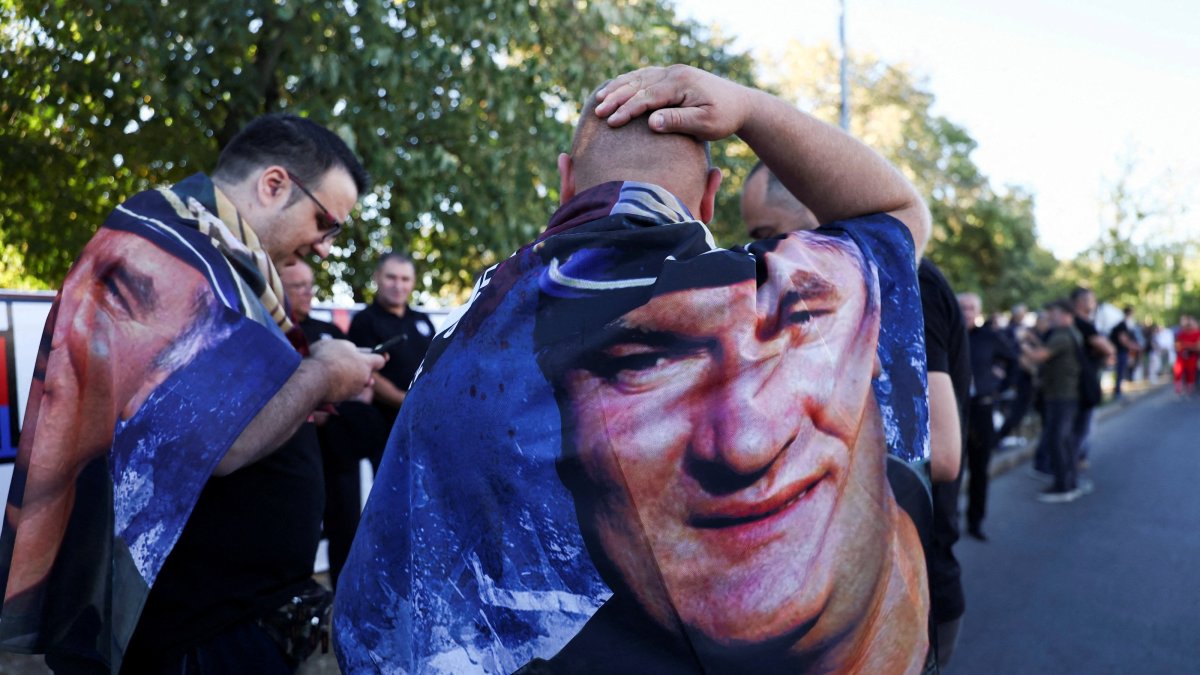 Men wearing capes with a picture of convicted war criminal Ratko Mladic in Belgrade, Serbia, Sept. 7, 2026. (Reuters Photo)