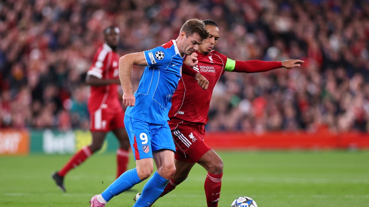 Atletico Madrid's Alexander Sorloth (L) and Liverpool's Virgil van Dijk during the UEFA Champions League 2025/26 League Phase MD1 match at Anfield, Liverpool, U.K., Sept. 17, 2025. (Getty Images Photo)