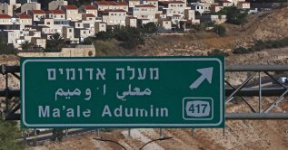Vehicles driving along the highway near the illegal Israeli settlement of Maale Adumim, on Sept. 8, 2026. (AFP Photo)