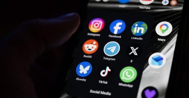 This photograph shows a set up smart-phone screen displaying the logo of main social media platforms, including Instagram, Facebook, LinkedIn, Reddit, Telegram, X, Bluesky, Tiktok and Whatsapp in Saint-Mande, east of Paris, France, April 29, 2026. (AFP Photo)
