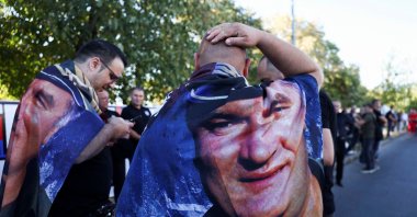Men wearing capes with a picture of convicted war criminal Ratko Mladic in Belgrade, Serbia, Sept. 7, 2026. (Reuters Photo)