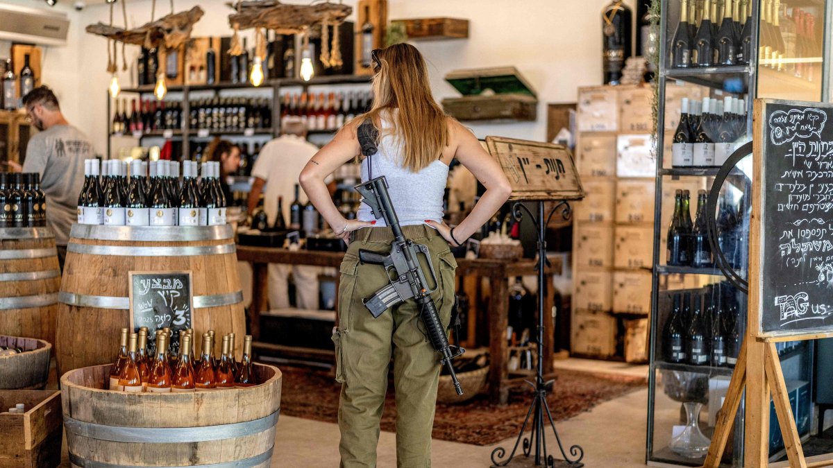 An Israeli soldier stands at a winery in the illegal Israeli settlement of Sha'ar Binyami, occupied West Bank, Palestine, Sept. 9, 2026. (AFP Photo)