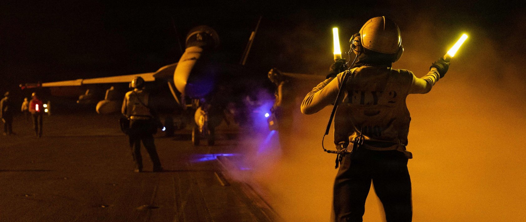 A U.S. sailor signals an F/A-18F Super Hornet on the flight deck of Nimitz-class aircraft carrier USS George H.W. Bush deployed in the Gulf, Sept. 1, 2026. (AFP Photo)