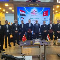 Turkish and Egyptian officials pose during a signing ceremony at El Alamein International Airport, Egypt, Aug. 10, 2026. (AA Photo)
