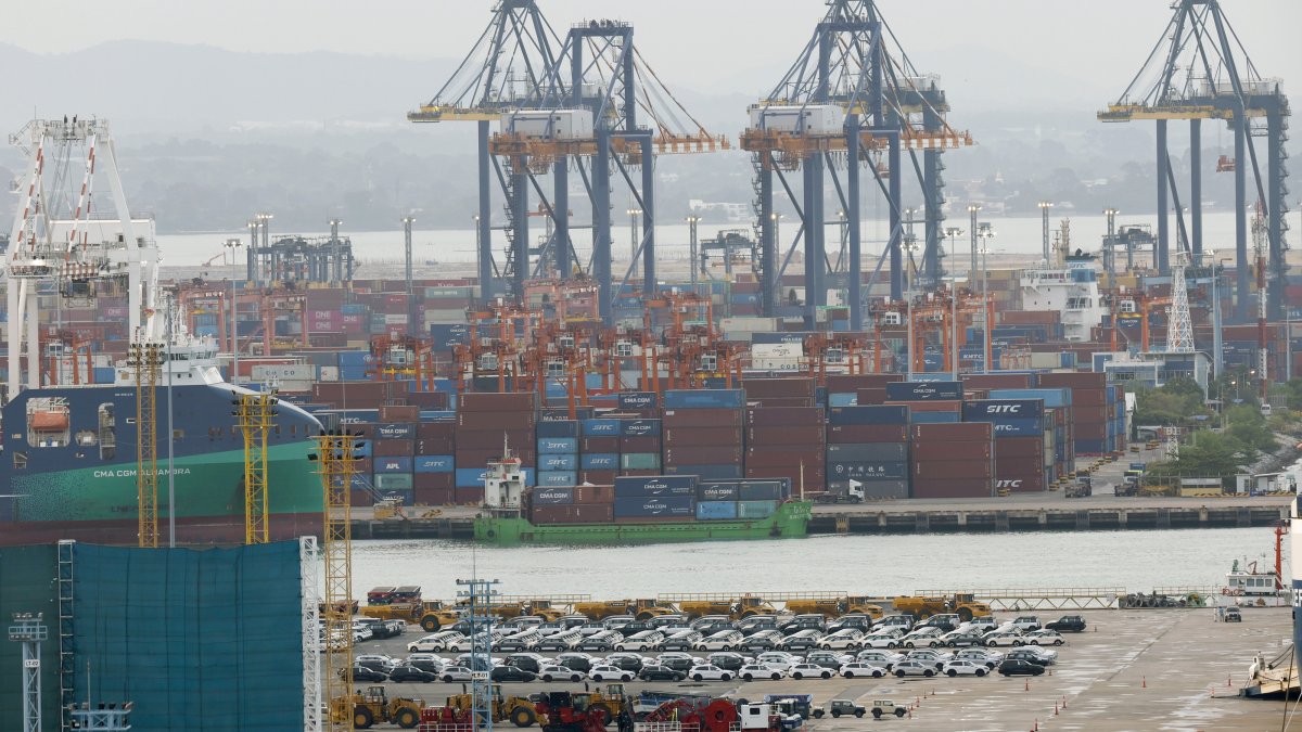 Stacked shipping containers and exported cars are prepared for shipment loading at Laem Chabang deep-sea port, Chonburi province, Thailand, Sept. 2, 2026. (EPA Photo)