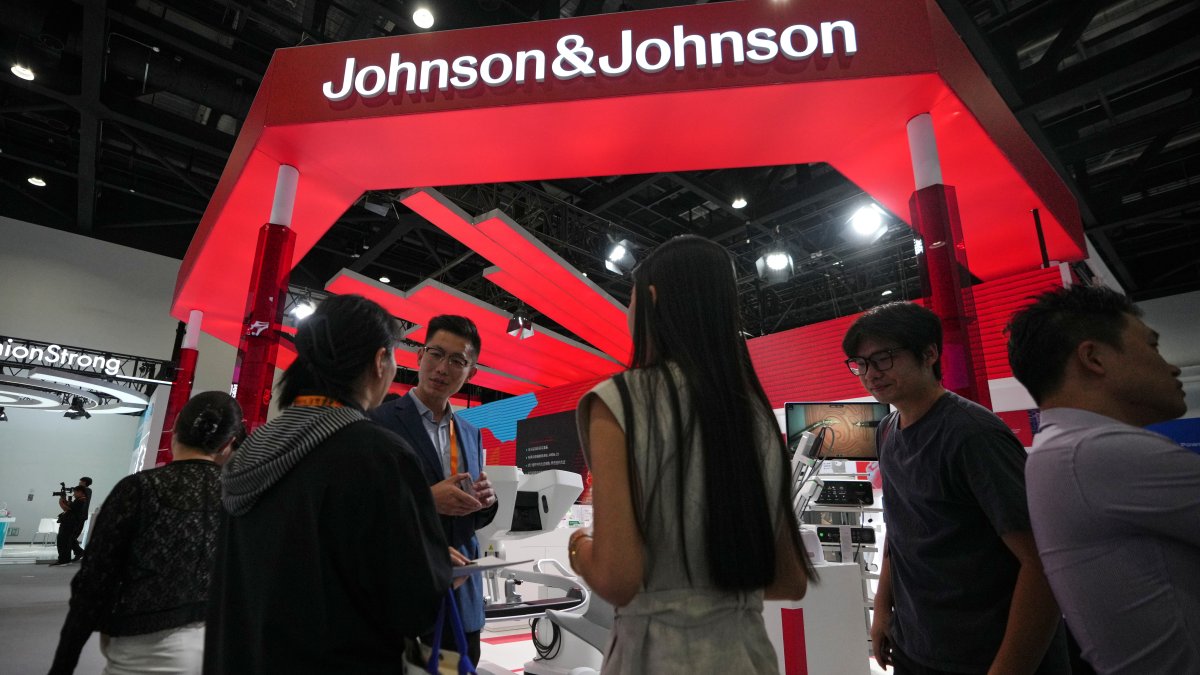Visitors tour a Johnson &amp; Johnson's booth promoting medical machines at the medical service sector for China International Fair for Trade in Services (CIFTIS), Beijing, China, Sept. 9, 2026. (AP Photo)