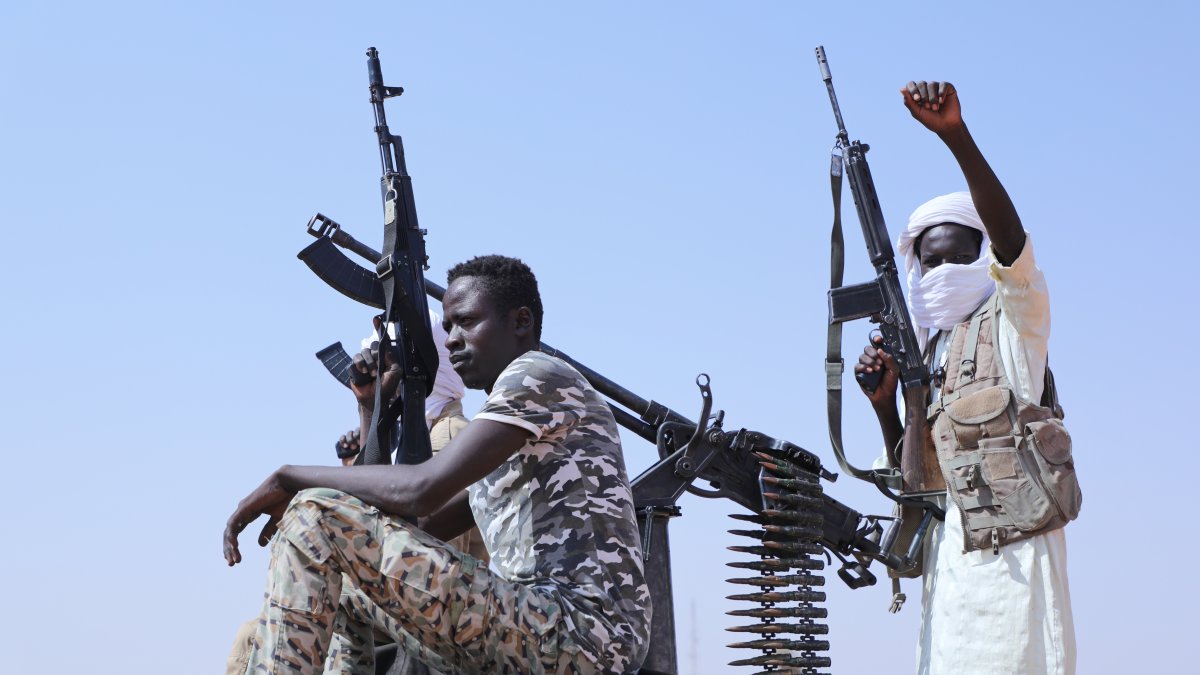 Former RSF members celebrate, as they are believed to be surrendering to the Sudanese army, Omdurman, just outside Khartoum, Sudan, Aug. 19, 2026. (AP Photo)