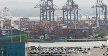 Stacked shipping containers and exported cars are prepared for shipment loading at Laem Chabang deep-sea port, Chonburi province, Thailand, Sept. 2, 2026. (EPA Photo)