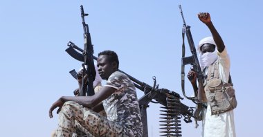 Former RSF members celebrate, as they are believed to be surrendering to the Sudanese army, Omdurman, just outside Khartoum, Sudan, Aug. 19, 2026. (AP Photo)