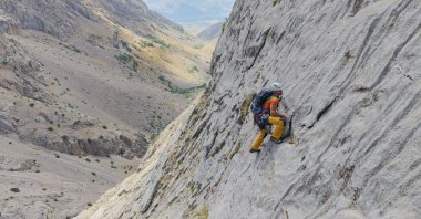 A climber ascends the Munzur Mountains in Ovacık, Tunceli, eastern Türkiye, Sept. 11, 2026. (AA Photo)