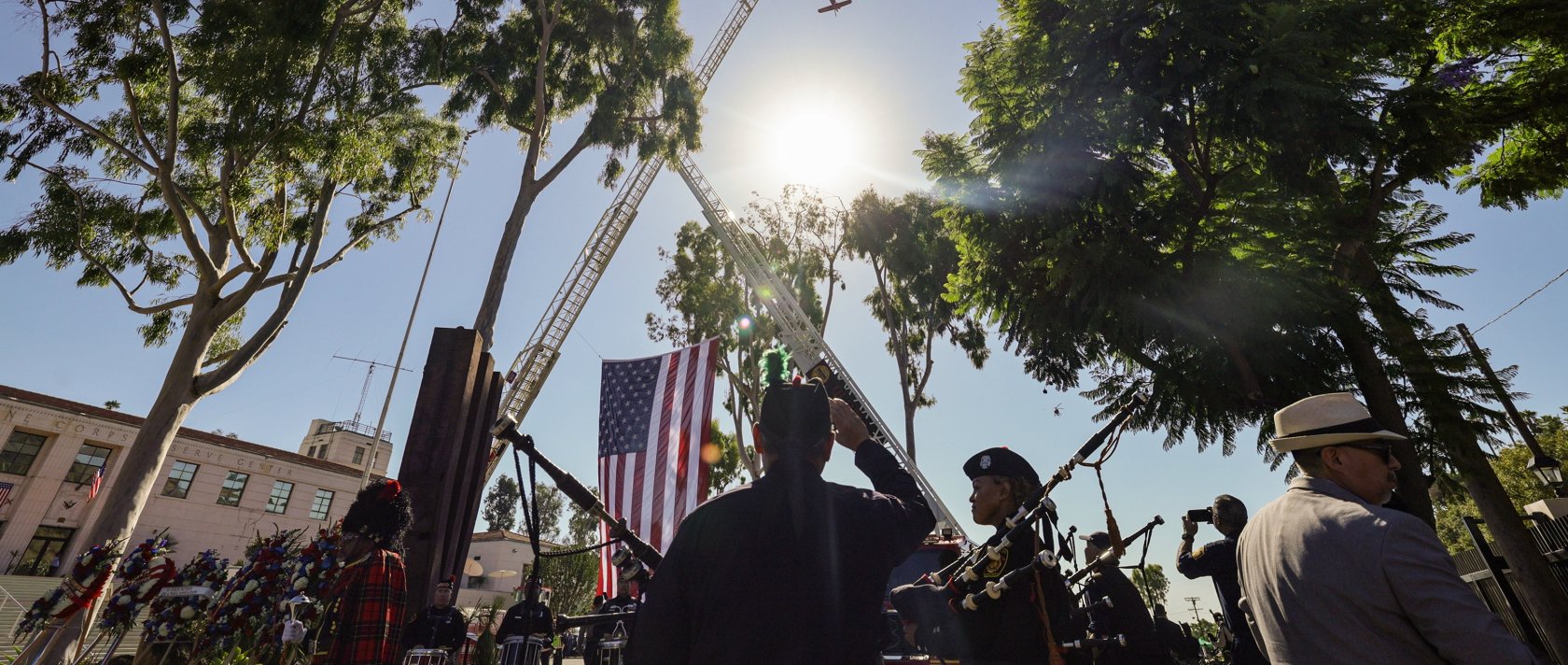 Participants watch as a Los Angeles Fire Department helicopter conducts a flyover during the 25th annual 9/11 Remembrance Ceremony in Los Angeles, California, Sept. 11, 2026. (EPA Photo)