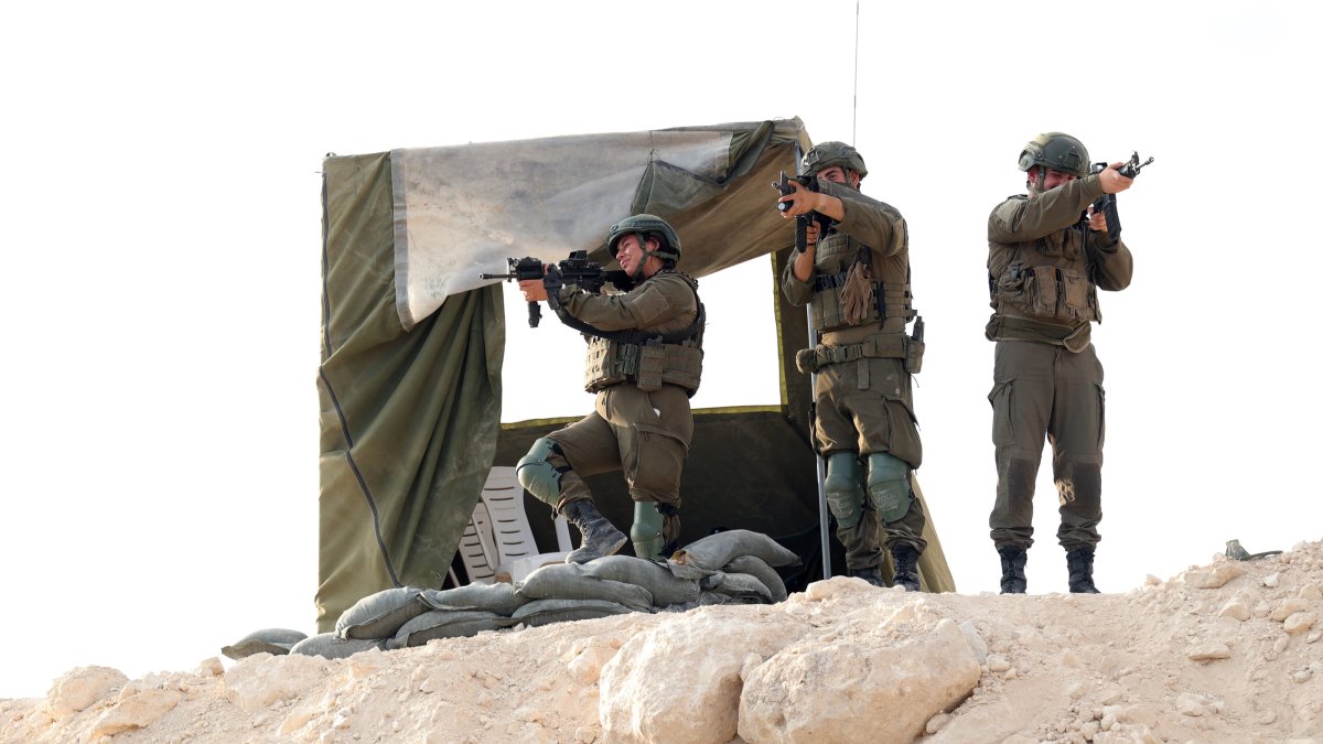 Israeli soldiers provide security during the inauguration of the new illegal Israeli outpost settlement near the Palestinian village of Dura, Hebron, occupied West Bank, Palestine, Aug. 31, 2026. (EPA Photo)