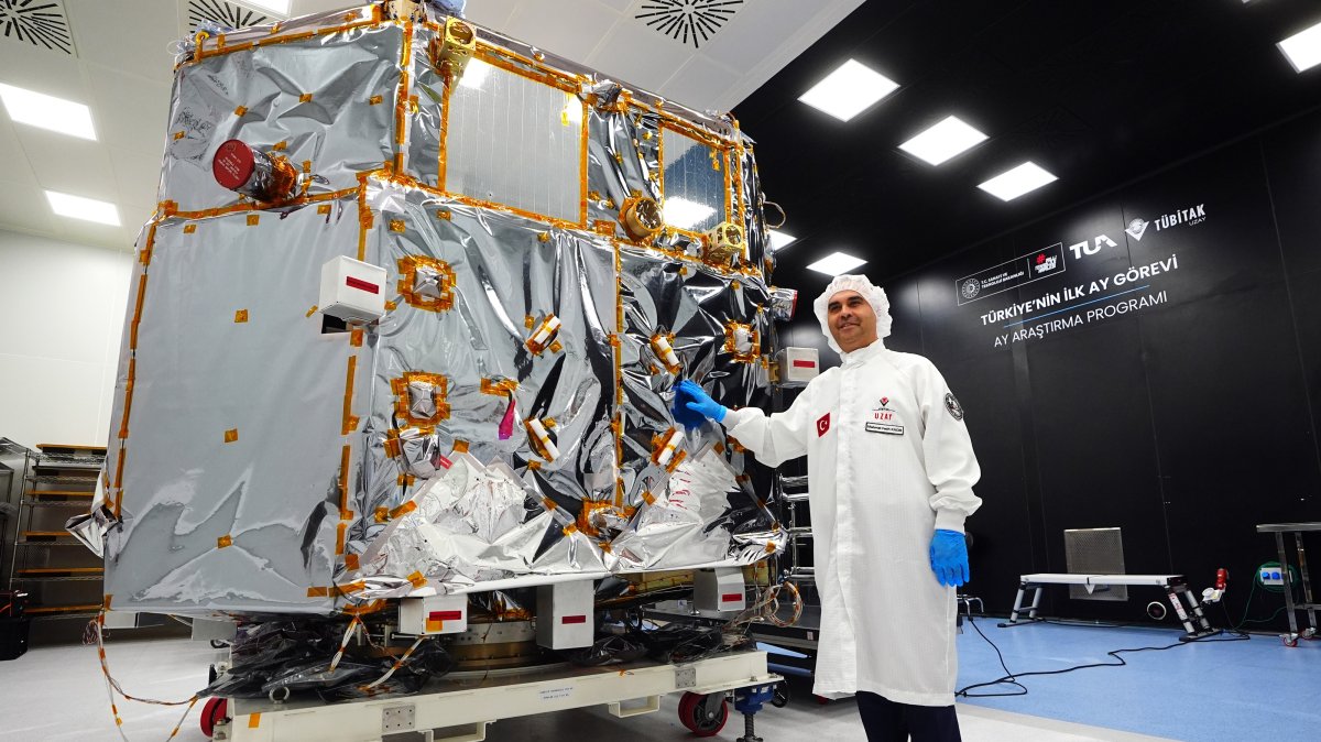 Industry and Technology Minister Mehmet Fatih Kacır poses in front of a spacecraft developed for Türkiye's first Moon mission, Ankara, Türkiye, Sept. 14, 2026. (AA Photo)