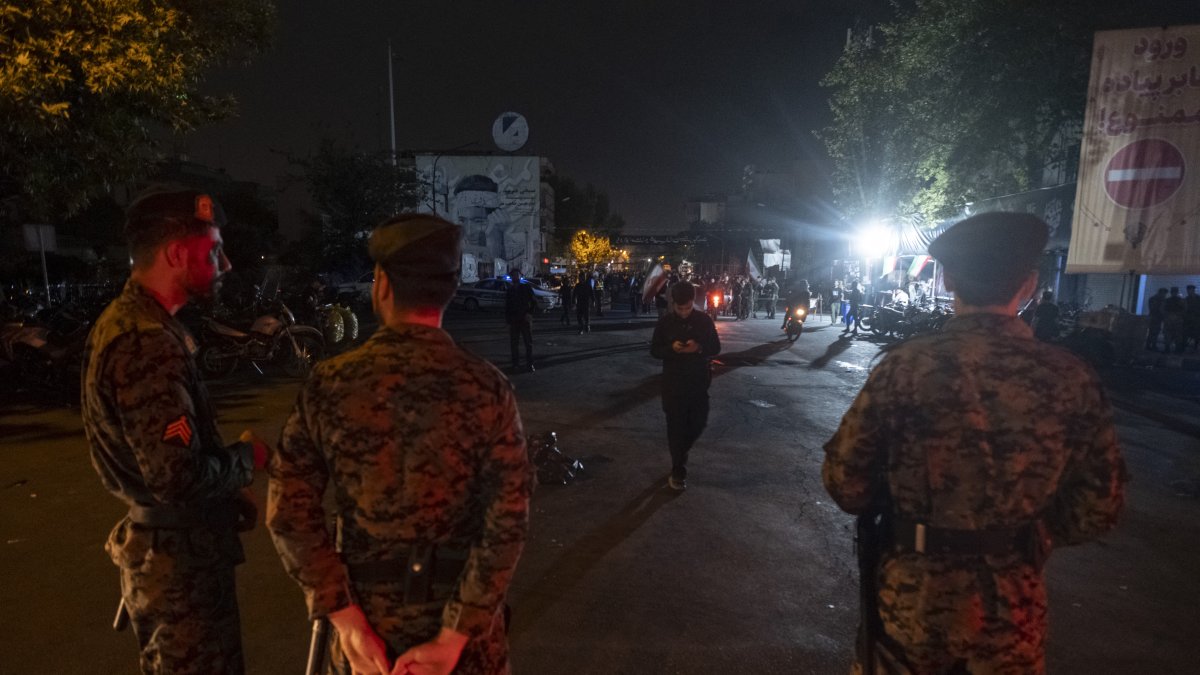 Iranian police officers monitor an area outside the Imam Khomeini Grand Mosque on the eve of a funeral in Tehran, Iran, on July 5, 2026. (AFP File Photo)