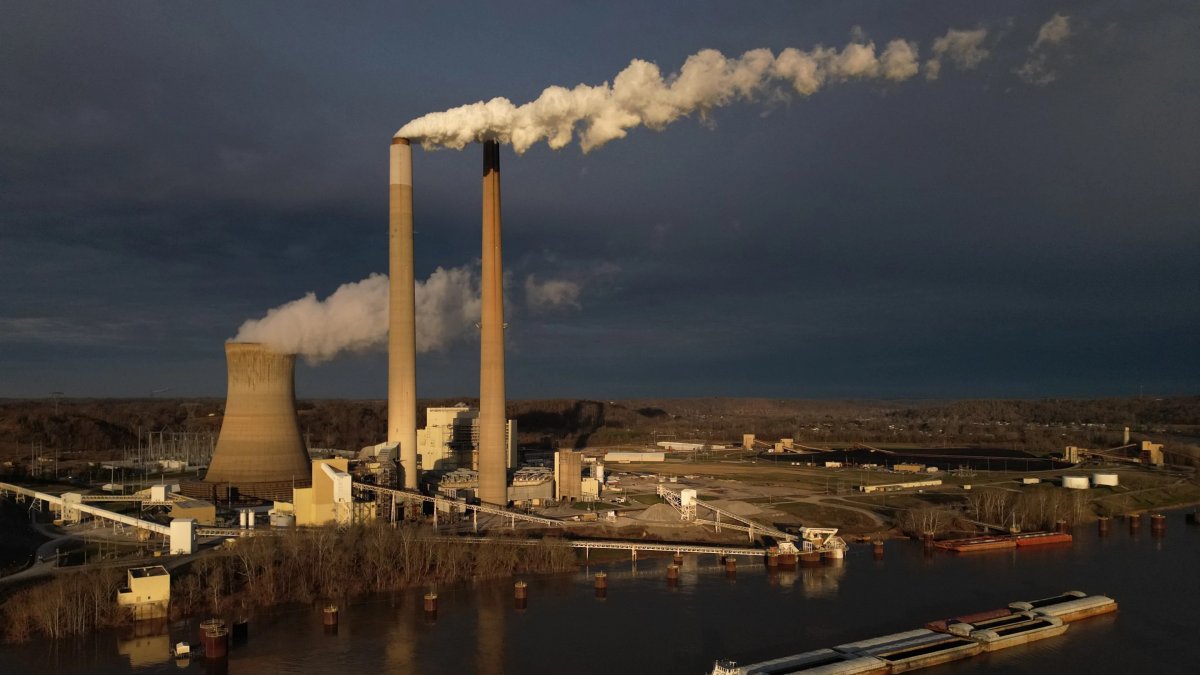A barge on the Ohio River moves past the Mountaineer Power Plant, a coal-fired power plant near New Haven, U.S., March 13, 2026. (AP Photo)