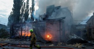 Firefighters work at the site of a non-residential building hit by a Russian drone strike, amid Russia's attack on Ukraine, in Kyiv, Ukraine, Sept. 11, 2026. (Reuters Photo)